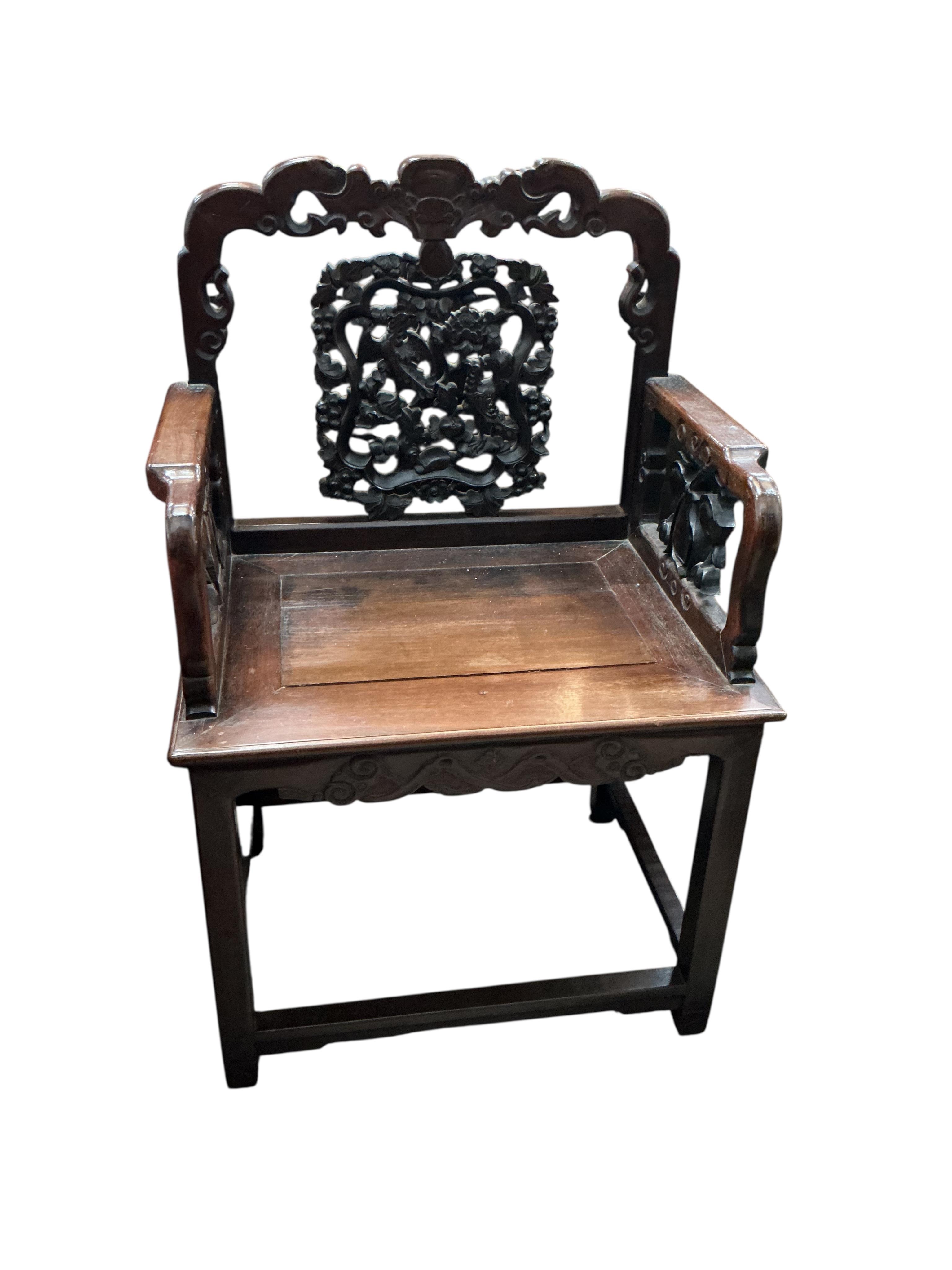 A near pair of Chinese Hongmu elbow chairs, width 64cm, depth 46cm, height 100cm